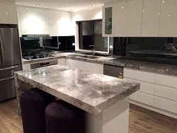 White kitchen with marble countertop photo