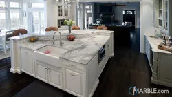 White kitchen with marble countertop photo