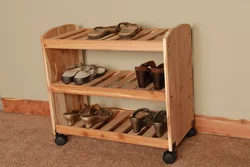 Shoe rack in the hallway made of wood photo