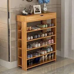 Shoe rack in the hallway made of wood photo