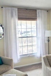 Tulle up to the window sill in the living room photo