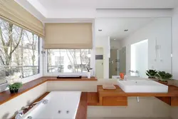 Sink by the window in the bathroom photo