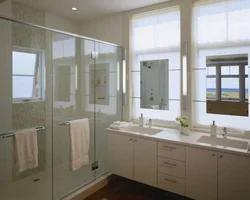 Sink by the window in the bathroom photo
