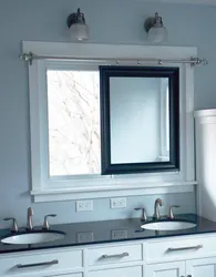 Sink by the window in the bathroom photo