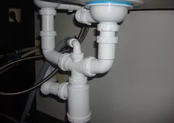 Pipe under the sink in the kitchen photo