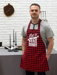 Men in an apron in the kitchen photo