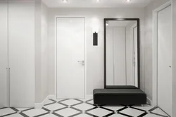 Photo of a hallway with a black floor