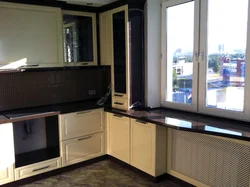 Wide window sill in the kitchen design