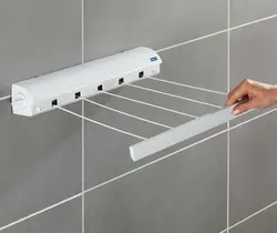 Wall-mounted dryer in the bathroom photo