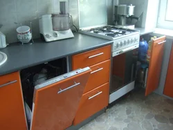 Kitchen with a regular stove photo