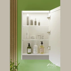 Photo of a wardrobe with a mirror in the bathroom