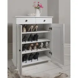 Chest of drawers for shoes in the hallway photo