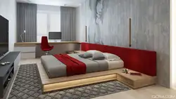 Қызыл кереуетпен жатын бөлменің интерьері