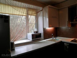 Microwave In The Kitchen On The Window Photo