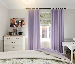 Colored curtains in the bedroom interior photo