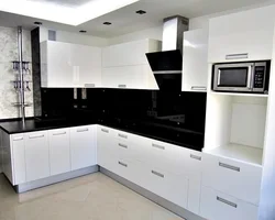 White kitchen with black stove photo