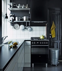 White kitchen with black stove photo