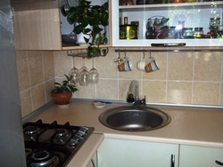 Sink against the kitchen wall photo