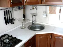 Sink against the kitchen wall photo