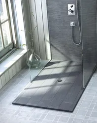 Shower with drain in bathroom photo