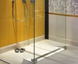 Shower with drain in bathroom photo