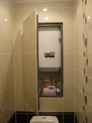 Photo Of A Toilet In An Apartment With A Boiler