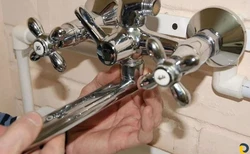 Photo of a disassembled faucet with bathtub