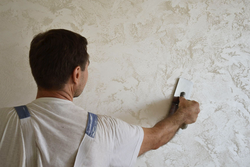 Decorative plaster of walls in an apartment with your own hands photo