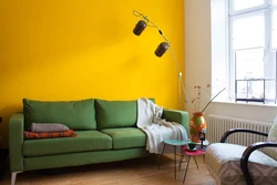 Green living room interior with yellow photo
