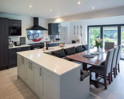 Modern kitchens with an island combined with a living room photo