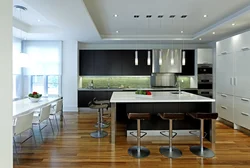 Modern kitchens with an island combined with a living room photo