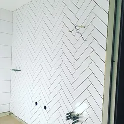 Bathroom design with herringbone tiles