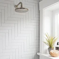 Bathroom design with herringbone tiles