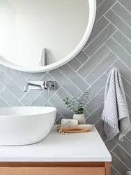 Bathroom design with herringbone tiles