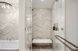 Bathroom design with herringbone tiles