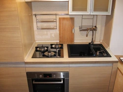 Kitchens with gas stove and refrigerator photo