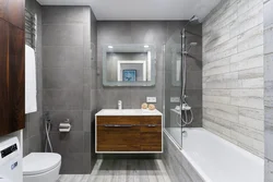 Bathroom design gray porcelain tiles and wood