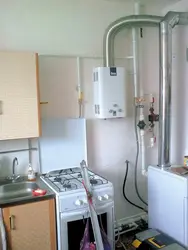 Floor-standing boiler and water heater in the kitchen photo