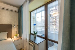 Balcony door in the bedroom interior