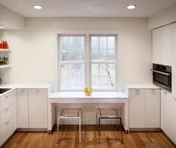Kitchen design with dining area by the window