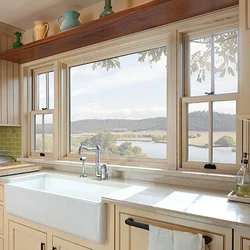 Kitchen in a wooden house with a sink by the window photo