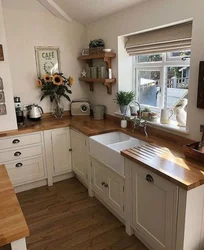 Kitchen in a wooden house with a sink by the window photo