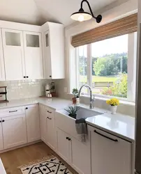 Kitchen in a wooden house with a sink by the window photo