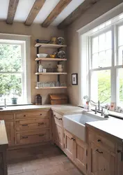 Kitchen in a wooden house with a sink by the window photo