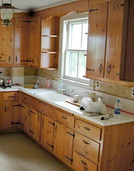 Kitchen In A Wooden House With A Sink By The Window Photo