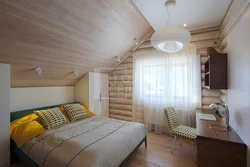 Bedroom design in a house with a wooden ceiling