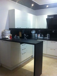 White And Black Kitchens With Bar Counters Photo