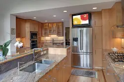 Kitchen design with refrigerator and TV
