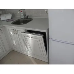 Kitchen in Khrushchev design with refrigerator and dishwasher