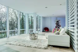 Living room with a large window in a modern style photo